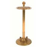 A BRASS STICK STAND with turned knop for six sticks on a circular base, 87cm high