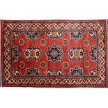 A TURKMEN STYLE WOOLLEN RUG 99cm x 158cm and two similar rugs (3)