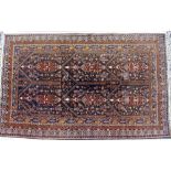 AN AFGHAN BALUCHI RUG with stylised geometric decoration, 200cm x 300cm