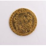 A GEORGE III GOLD GUINEA dated 1776