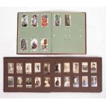 TWO ALBUMS OF CIGARETTE CARDS to include Ogden's Guinea Gold, and others to include Players