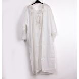QUEEN VICTORIA'S LINEN AND LACE NIGHTDRESS with crown above monogram VR 36 cipher, with ruffled lace