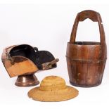 AN ORIENTAL RICE BUCKET 61cm high together with a bamboo hat and a copper helmet shaped coal scuttle