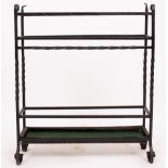 A WROUGHT IRON STICK STAND with five sections, 65cm wide x 77cm high