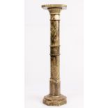 A GREEN STONE TORCHERE with turned support 24cm wide x 98cm high