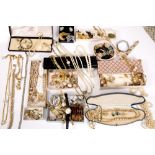 A LARGE COLLECTION OF COSTUME JEWELLERY to include simulated pearl necklaces, ear clips, ladies