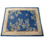 AN EARLY TO MID 20TH CENTURY CHINESE BLUE GROUND SMALL CARPET with stylised foliate decoration,