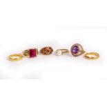 A COLLECTION OF RINGS comprising two 22ct gold wedding bands, an amethyst single stone ring and