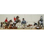 A COLLECTION OF BESWICK PORCELAIN FOX HUNTING RELATED FIGURINES to include hounds, foxes and horses