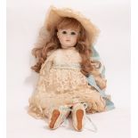 AN ANTIQUE FRENCH BISQUE HEADED DOLL by Jules Steiner of Paris, marked to the back of the head, with