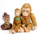 AN OLD STEIFF STUFFED TOY MONKEY 43cm high; a smaller stuffed toy monkey and a Victorian style