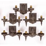 FIVE CAST METAL DOUBLE SCONCE WALL LIGHTS decorated with coats of arms, 21cm approximately x 29cm
