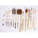 A COLLECTION OF ANTIQUE IVORY AND BONE MOUNTED NEEDLEWORK TOOLS to include needle cases etc.,