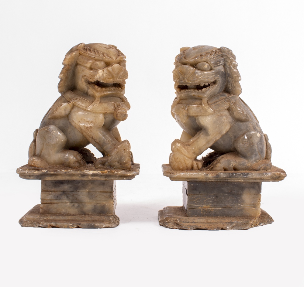 A PAIR OF LATE 19TH / EARLY 20TH CENTURY CHINESE SOAPSTONE DOGS OF FO 18cm high