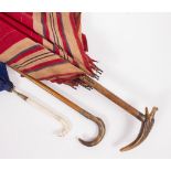 A 19TH CENTURY CHILD'S IVORY HANDLED PARASOL with hound's head finial, 59cm long together with a