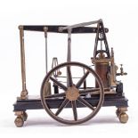 A WELL MADE CAST IRON AND GUN METAL GRASSHOPPER TYPE MODEL BEAM ENGINE with central fly wheel,