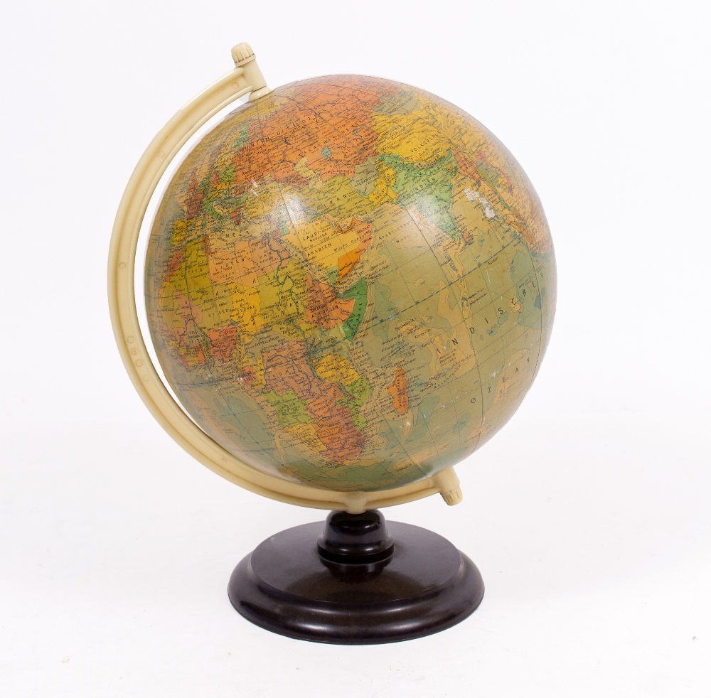A MID 20TH CENTURY GERMAN GLOBE with a plastic and Bakelite stand, 30cm diameter x 47cm high