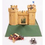 A CHILD'S TOY WOODEN FORT with a quantity of composite figures, the base 66cm square