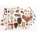 A COLLECTION OF MILITARY BUTTONS and badges together with two steel button press dies etc.,
