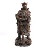 A CHINESE HARDWOOD FIGURE OF A WARRIOR with glass eyes, 57cm in height