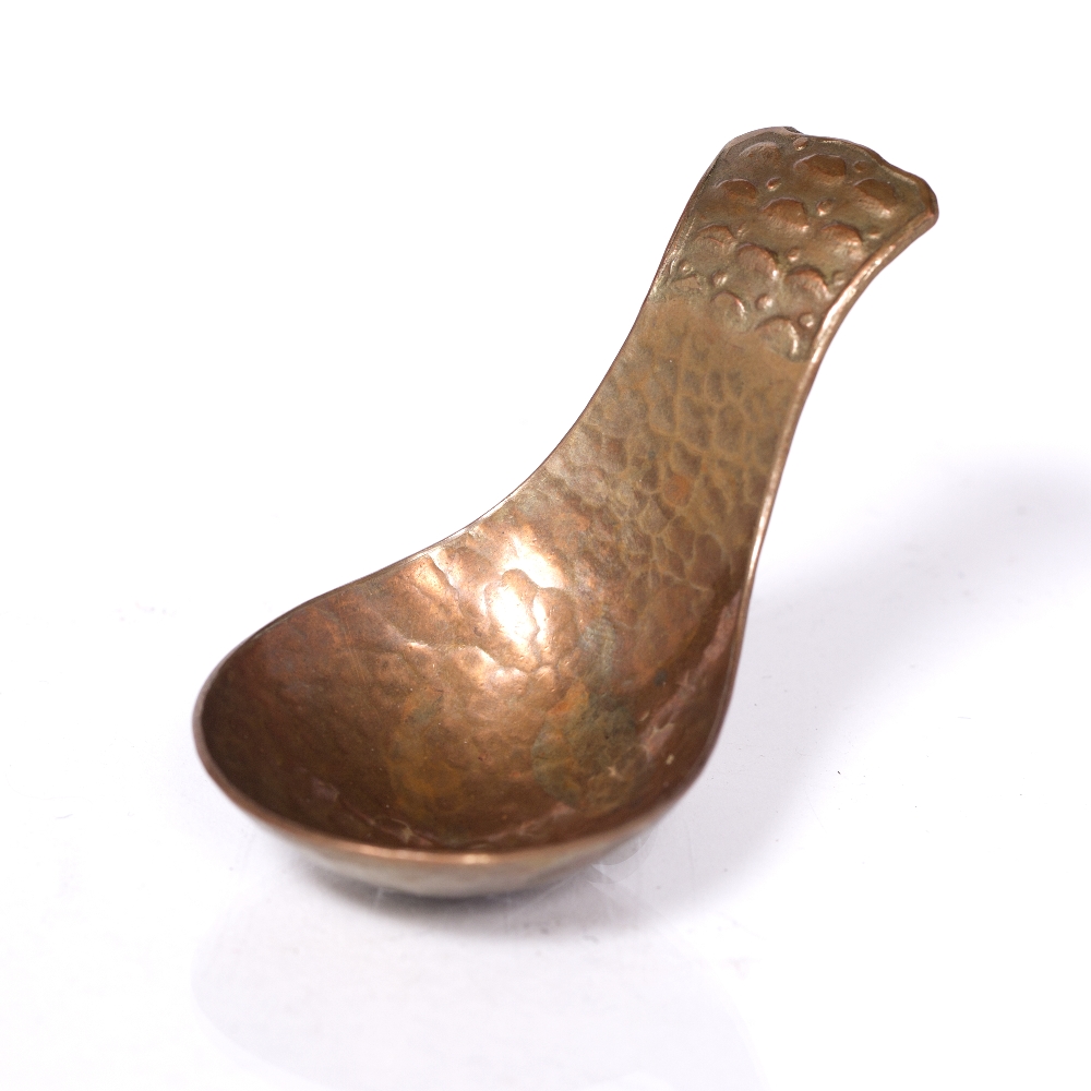 Arts & Crafts Hammered copper caddy spoon marked 'GWG' 7.2cm long.