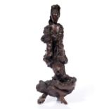 A Chinese carved naturalistic wood (root wood) model of Guanyin 19th Century the standing figure