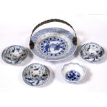 A Chinese blue and white miniature dish 18th Century later mounted with a handle, three Chinese