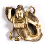 A Japanese ivory netsuke of an Apsara (Tennin) late Meiji depicted in flight and a drum at chest