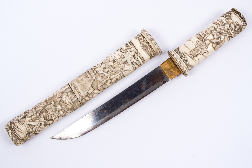 A Japanese ivory dagger (tanto) late 19th Century carved with figures, geese and domestic scenes