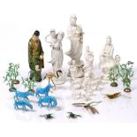 A collection of Chinese pieces to include blanc de chine, miniature horses, menu stands and other