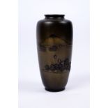 A Japanese bronze vase Meiji period signed, inlaid in silver showing boats on lake Biwa before Mount