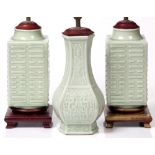 A pair of Chinese celadon cong shaped vases now lamps, 25cm high and one other Chinese celadon