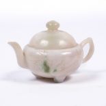 A Chinese white jade teapot and cover 19th Century the squat globular body showing a single green