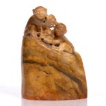 A Chinese soap stone carved seal in the form of monkeys, 8cm high