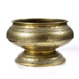 A Javanese brass pedestal bowl 19th Century engraved with bands of geometric and floral designs,