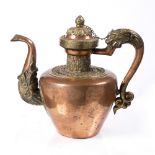 A Tibetan large copper and brass Bhumpa (teapot) 19th Century with beast head handle and spout,