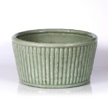 A Chinese celadon ground jardiniere, the exterior with simulated bamboo, 33cm
