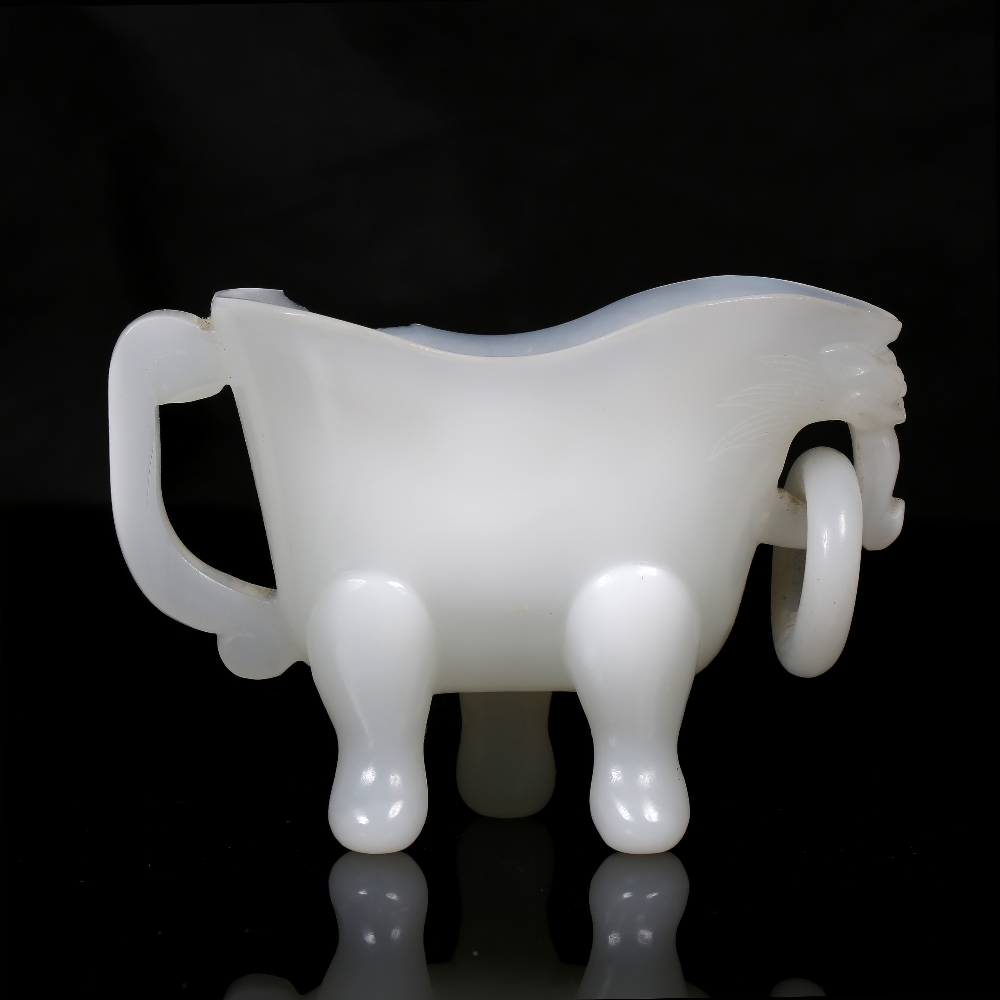 A Beijing opaline white glass libation cup 19th Century the flattened body on tripod feet with - Image 2 of 4