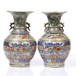 A pair of Chinese Canton baluster vases 19th Century with bands of figures, temple dogs, ruyi and