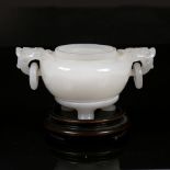A fine Beijing white glass emulating jade two handled ting 19th Century the squat rounded body