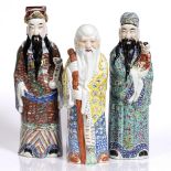 Three Chinese polychrome figures of Immortals late 19th/20th Century largest 49cm