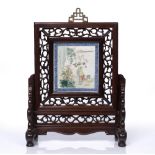 A Chinese famille verte table screen 19th/20th Century with hardwood stand, 25cm x 24cm