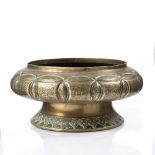 A Persian engraved brass pedestal bowl 25cm