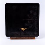 A Japanese black lacquer square tray Meiji period having a bird upon a branch, 34.5cm square