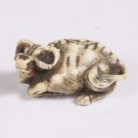 A Japanese bone netsuke of a reclining ox Meiji with rope halter, Kyoto style, 6cm long