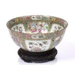 A large Chinese Canton punch bowl circa 1870 having panels of birds, butterflies and interior scenes