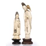 Chinese carved ivory model of Guanyin 19th Century holding a lotus flower and basket on a carved