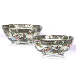 A pair of Chinese Canton punch bowls late 19th Century the exterior painted with warrior and other