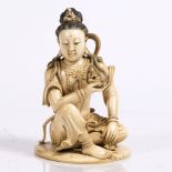 A Chinese carved ivory figure of Quanyin early 20th Century (1920/1930) depicted seated upon a