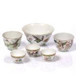 A Chinese famille rose porcelain bowl decorated exotic butterflies and symbolic flowers, six